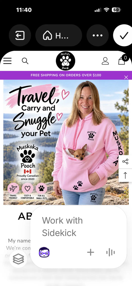 A pet parent in a pink Muskoka Pooch hoodie with a Chihuahua in the front pouch, overlooking a Muskoka lake